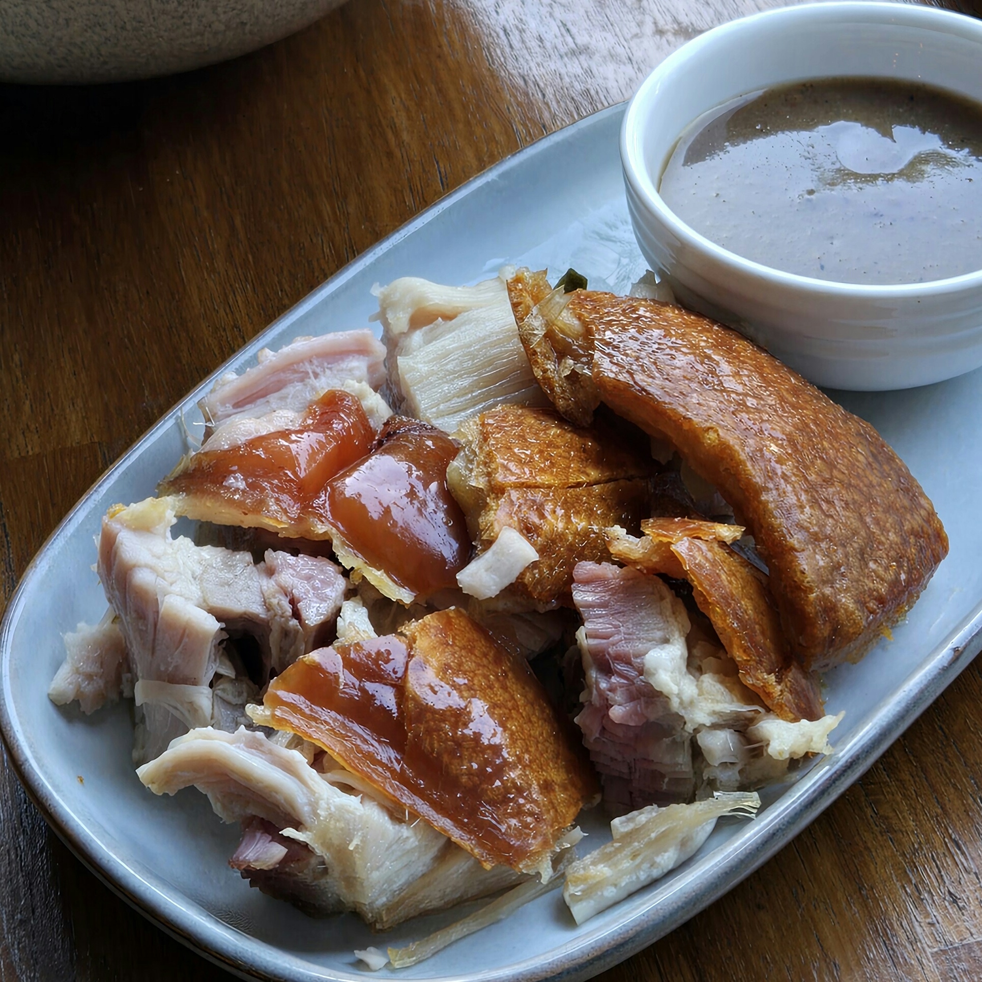 Cebu Lechon with crispy skin and Mang Tomas dipping sauce served at Descanso Cafe Sydney